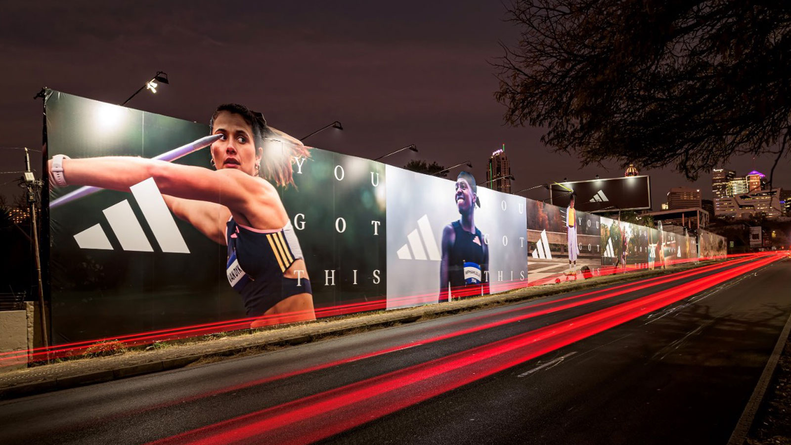 Large outdoor brand campaign display and advertising activation along a city road