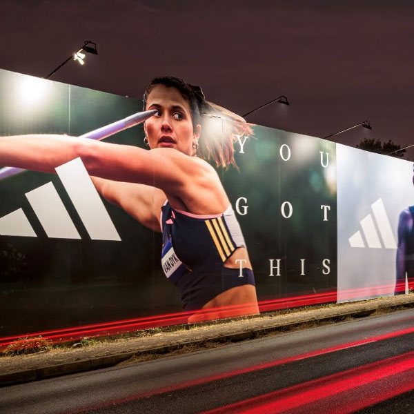 Large outdoor brand campaign display and advertising activation along a city road