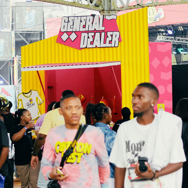 Consumers engaging with a branded experiential marketing activation at a live event