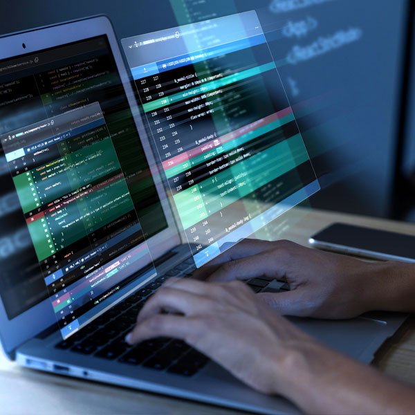 Person analysing retail operations data on a laptop