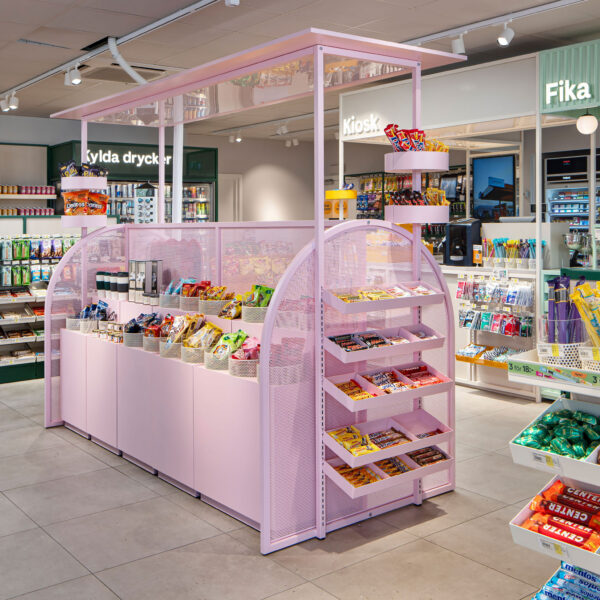 Modern retail store interior featuring a colourful kiosk display designed to attract shoppers and enhance visual merchandising