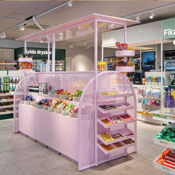 Modern retail store interior featuring a colourful kiosk display designed to attract shoppers and enhance visual merchandising