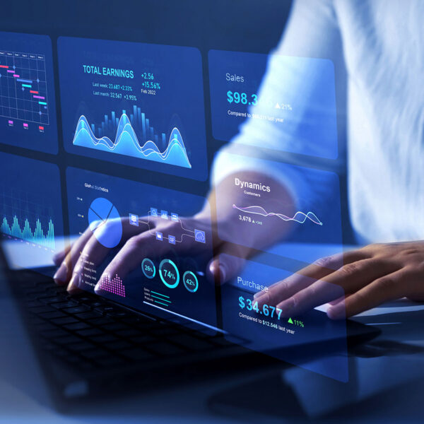 Professional analysing retail performance data on a laptop dashboard
