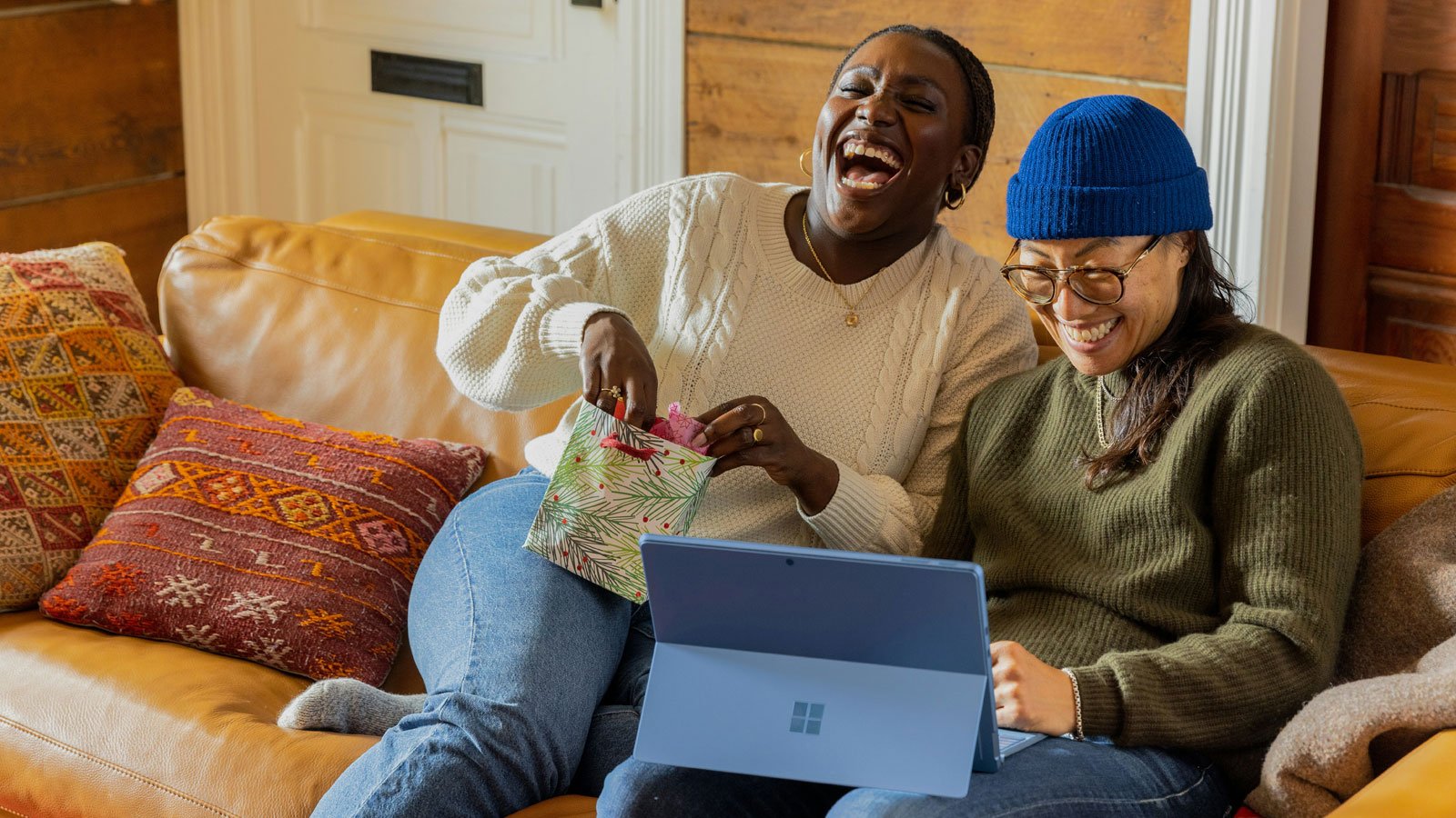 Consumers engaging with a digital device at home representing digital retail insights and shopper behaviour data