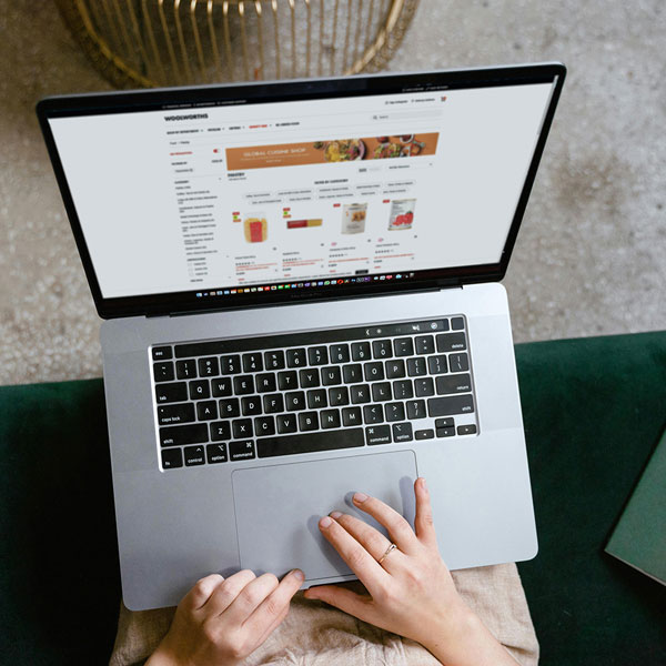 Shopper browsing products on an online retail website on a laptop