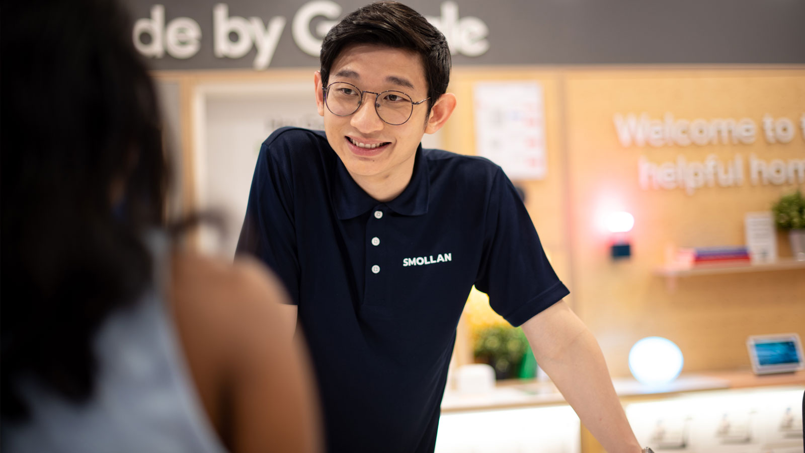 Retail sales associate assisting a customer in store