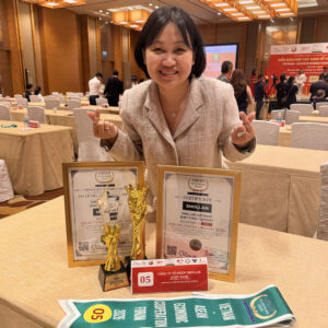 Smollan Vietnam award winner with ASEAN trophies and certificates.
